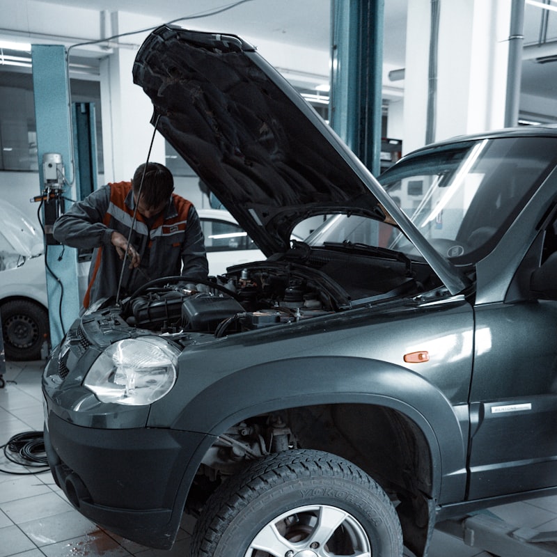Auto technician working on vehicle